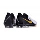 Bota Nike Phantom Luna 2 Elite FG Blanco Negro Mtlc Dorado Moneda