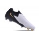 Bota Nike Phantom Luna 2 Elite FG Blanco Negro Mtlc Dorado Moneda
